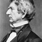 Black and white portrait of an older man in profile, wearing a dark suit, vest, white shirt, and patterned cravat. He has wavy, graying hair and a prominent nose, looking serious and composed.